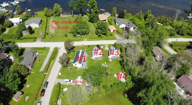 Family Relaxation Place for 2-15 People - 4 Lakeview Cottages with Real Sandy Swimming Beach, Dock, Boats, Firepits, Recreation Room, Prenota Hotel Kawartha Lakes Ontario