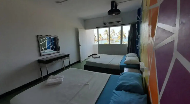 Standard quadruple chambre avec balcon et Vue mer Panamerican Hostel