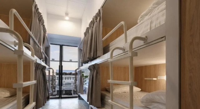 Кровать в общем номере Our Nomad Boutique Hostel