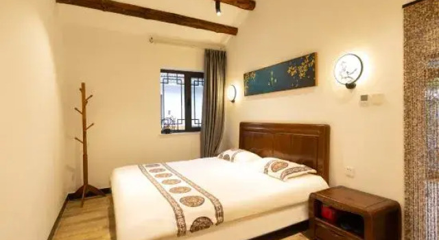 Кровать в общем номере Miaofeng Homestay