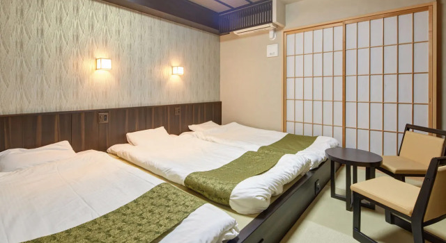 Кровать в общем номере Hotel Amaterrace Nippombashi-higashi