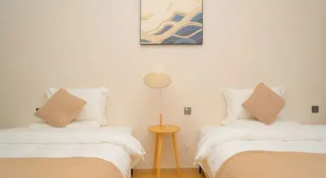 Кровать в общем номере Dali Nanfeng Guojing Hotel (Ideal City)