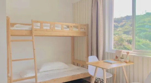 Кровать в общем номере Shengsi Hai Le Zhi Jia Hotel