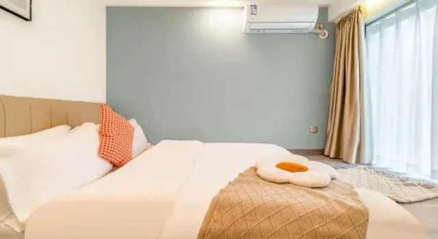 Кровать в общем номере Xingting Hotel