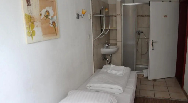 Кровать в общем номере Hotel Lilienhof