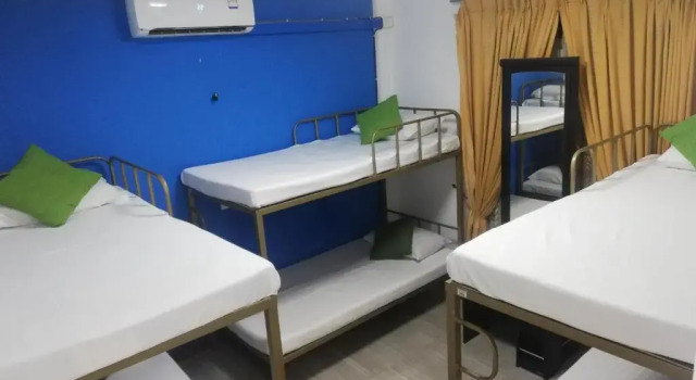 Кровать в общем номере Believe Inn