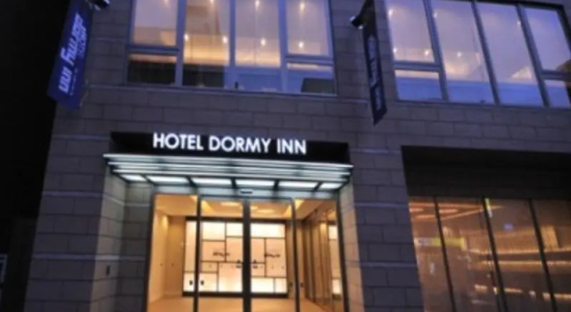 Кровать в общем номере Dormy Inn Obihiro