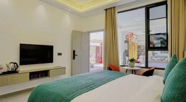 Кровать в общем номере Tengchong Heshun Aidi Jia Homestay