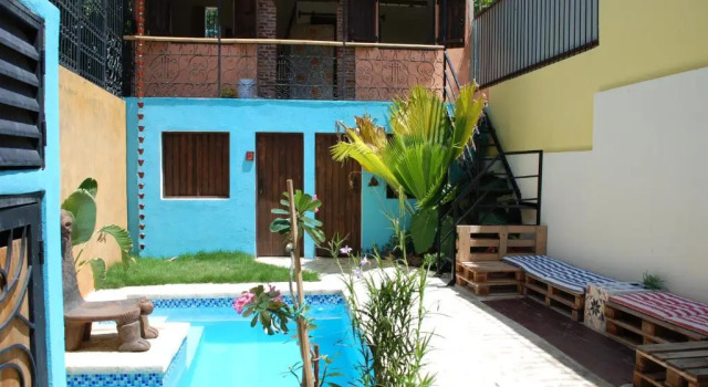 Кровать в общем номере La Choza Guesthouse