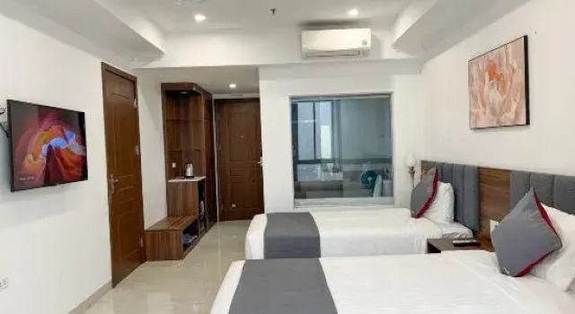 Кровать в общем номере Kezan Vinh Hotel