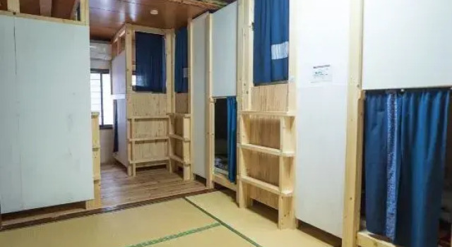 Кровать в общем номере Guesthouse Kuroshima