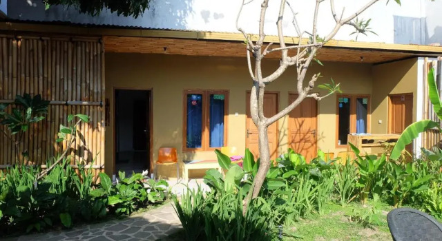 Кровать в общем номере Hotel Jogja Kili Suci By Simply Homy