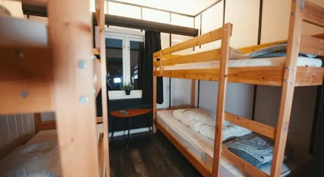 Кровать в общем номере Gjestehuset102