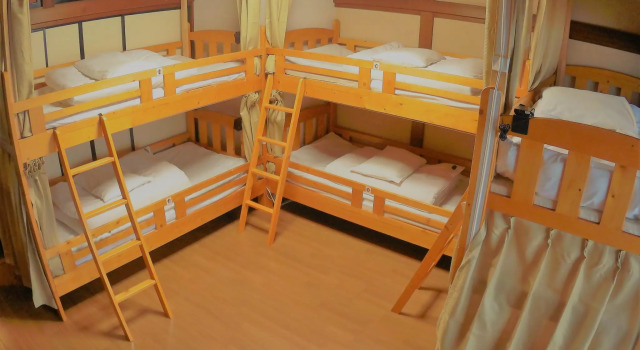 Кровать в общем номере Guest House Ga-Jyun
