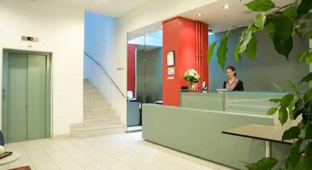 Кровать в общем номере Hotel City am Bahnhof