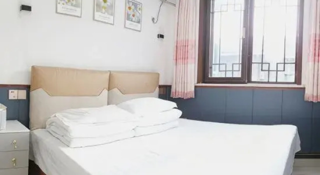 Кровать в общем номере с 4 комнатами Jingxinju Inn (Beijing Miyun Old Town)
