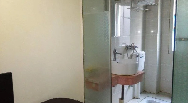 Tongxing Business Hotel, Prenota Hotel Enshi Prefecture Cina