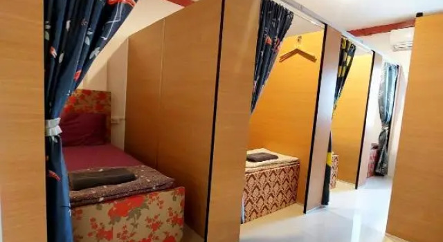 Кровать в общем номере Great House 99
