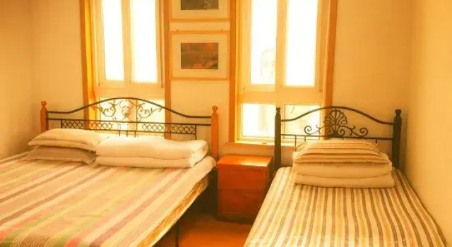 Кровать в общем номере Yijia B&B (Qingdao Jinshatan Branch)