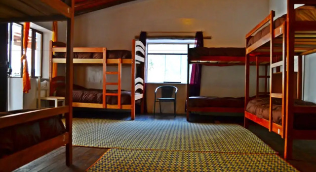 Кровать в общем номере Hostal Chaska Wasi