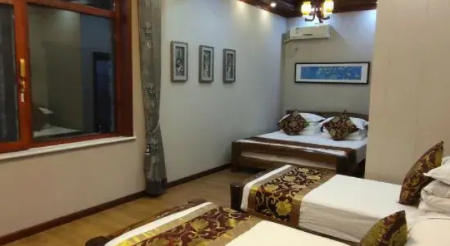 Кровать в общем номере Fulai Homestay