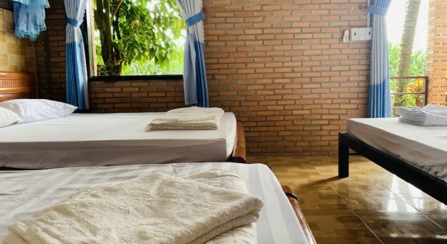 Кровать в общем номере Gibbon Singing Home Stay
