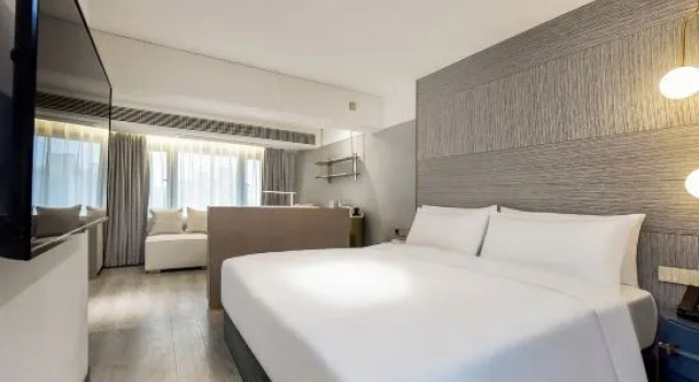Люкс Premier Kuanrong Suites Hotel (Liangjiang love sea shopping park)
