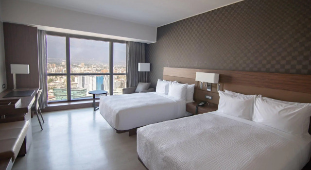 Четырёхместный номер Standard AC Hotel by Marriott Santiago Cenco Costanera