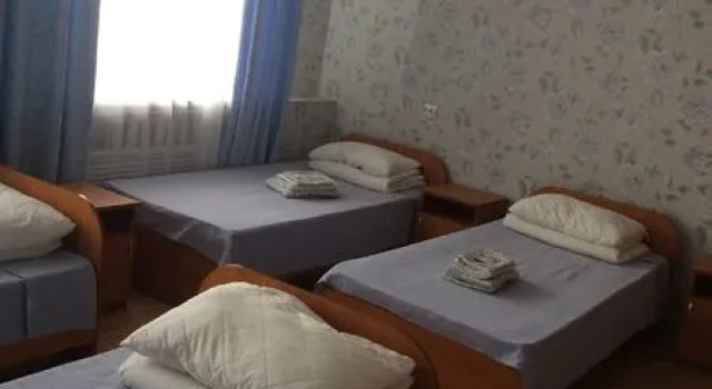 Кровать в общем номере Гостиница Колос