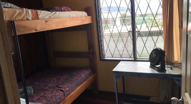 Кровать в общем номере с красивым видом из окна In the Wind Hostel and Guesthouse