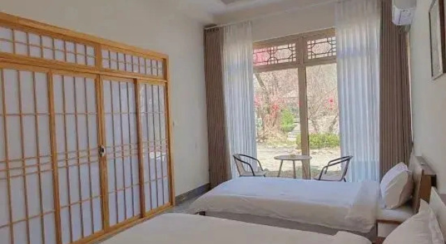 Suite Yiru Homestay (Zhouzuling Yaowangdong Wellness Town Scenic Area)