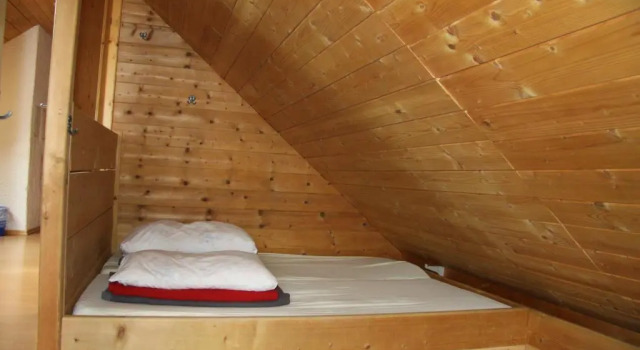 Кровать в общем номере Lodge am Krippenstein