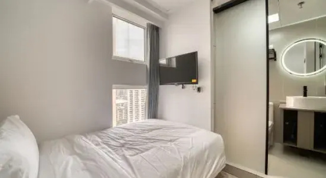 Кровать в общем номере (мужской номер) Huatiancan Hotel (Xihu Zhonghe North Road Subway Station)