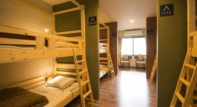 Кровать в общем номере BEPPU ROJIURA stay&sauna
