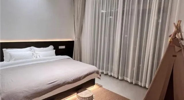 Люкс Deluxe с 2 комнатами Pingtan QiXi  Homestay (Tannan Bay Platinum Beach Branch)