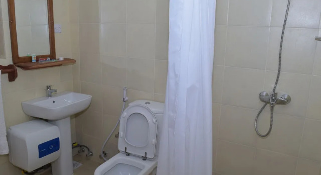 Номер Economy Chukwani Executive Inn