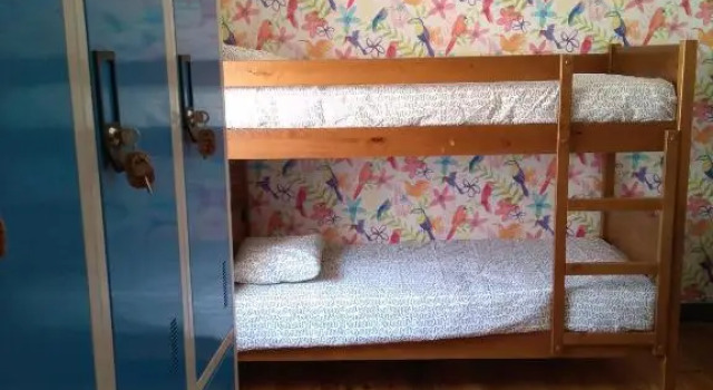Кровать в общем номере Hostel Raymundo