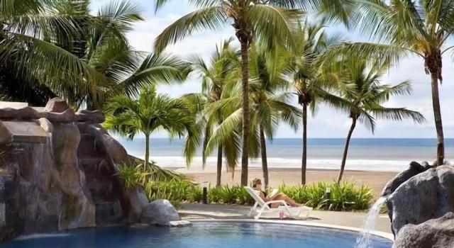 Апартаменты Elegant Beachfront Condo at Diamonte del Sol - 801s by RedAwning