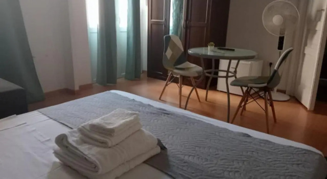 Кровать в общем номере Hotel Brioni