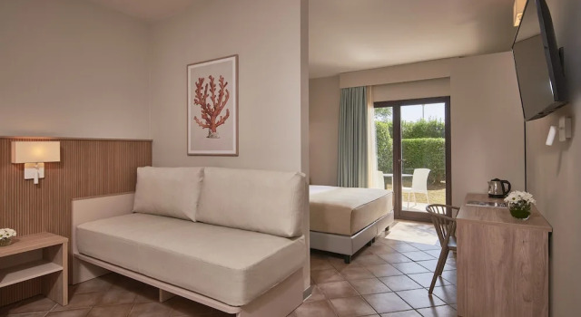 Family room with garden view Torreserena Resort