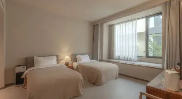 Кровать в общем номере Qixiangli Mifuxing Home