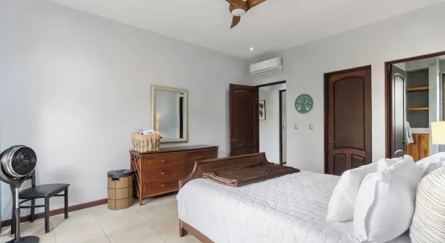 Modern Island-Themed Condo with Floor-to-Ceiling Windows & Garden and Pool Views Within Walking Distance of the Beach
