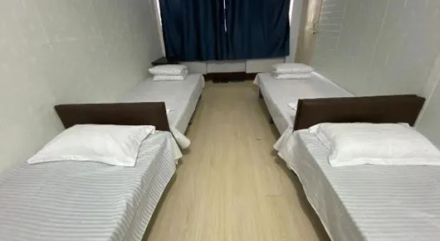 Кровать в общем номере Bo'ai Jinlu Hotel