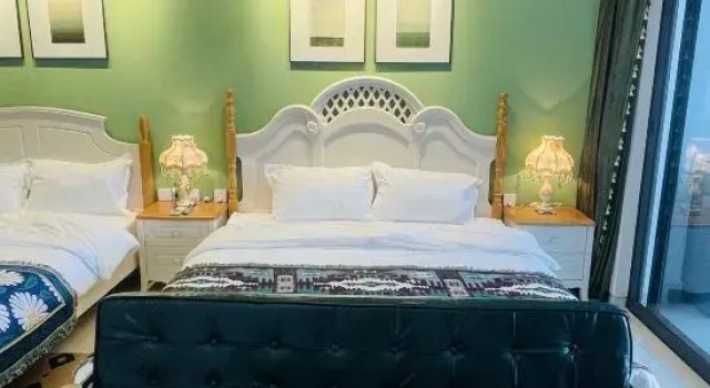 Семейный люкс Deluxe с 3 комнатами с видом на море Beihai Huanan Thematic Scenic Apartment (Beihai Golden Beach Beibu Bay No.1)