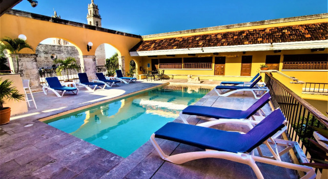 Кровать в общем номере Hotel Caribe Merida Yucatan