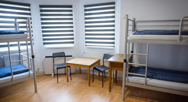 Кровать в общем номере Wheelinger Homestay