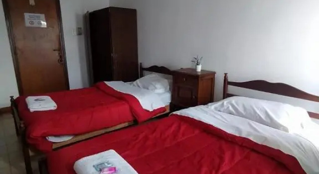 Кровать в общем номере HOSTAL TILIAN