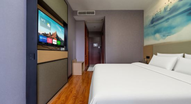Кровать в общем номере Baiyi Hotel (Suzhou Taihu Xukou Metro Station)