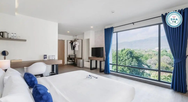 Кровать в общем номере Kokotel Chiang Mai Nimman