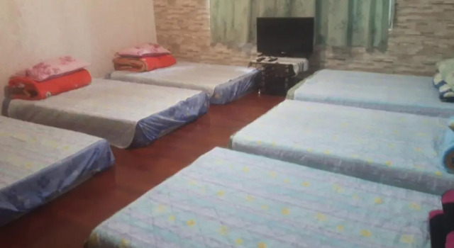 Кровать в общем номере Dai Yi Shia B&B